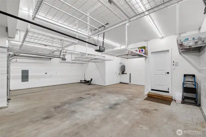 Bump out in the back for added storage space or work space. Tankless water heater mounted to back wall. Automatic garage door openers for both doors. Garages like this can be tough to come by in Tehaleh!