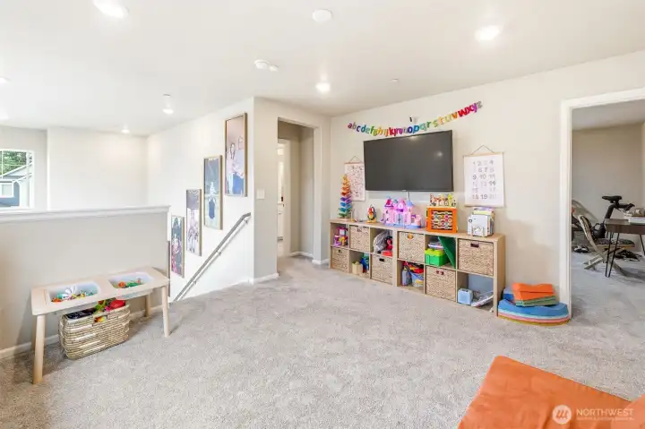 Upstairs you'll find the perfect flexible loft area... for play or work.
