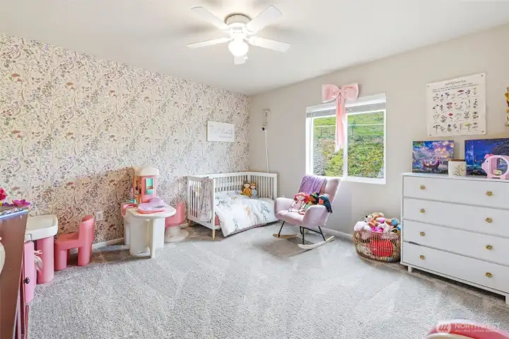 Bedroom 4 has whimsical wallpaper that can stay or is easily removable.