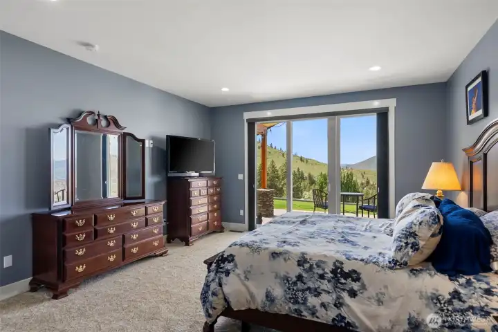 Primary suite with private patio with lake views