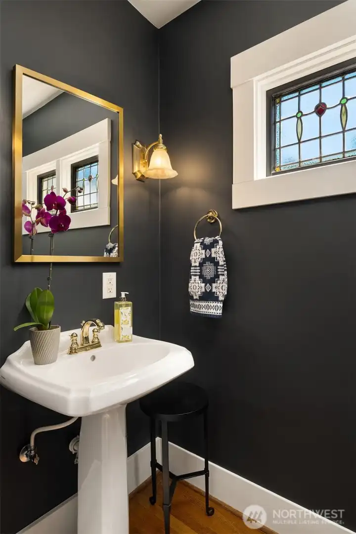Main-level powder room with jewel-box flair. Main-level powder room with jewel-box flair.