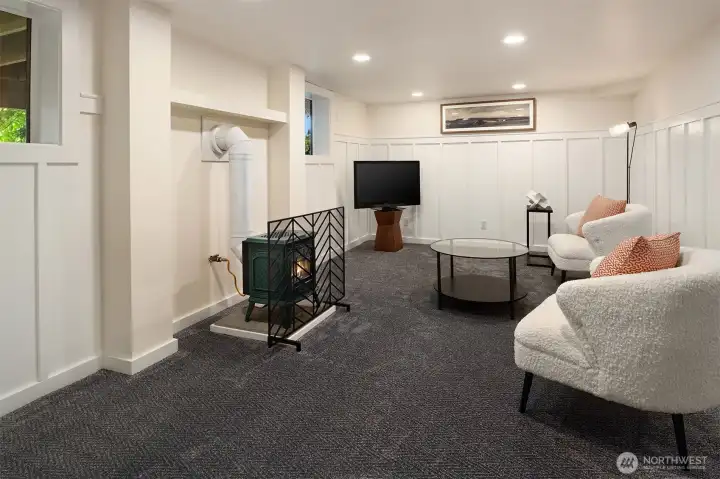 A large, versatile secondary living room with custom wainscoting. A large, versatile secondary living room with custom wainscoting.