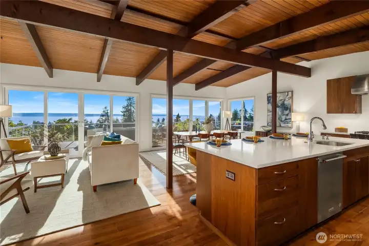Main living area with vaulted ceilings featuring exposed wood.