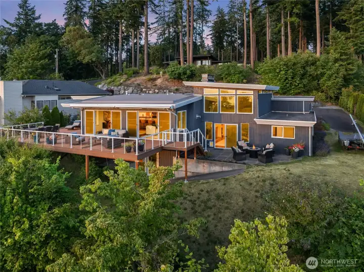 Looking east to the rear of the home. Classic mid-century architecture. New roof in 2023