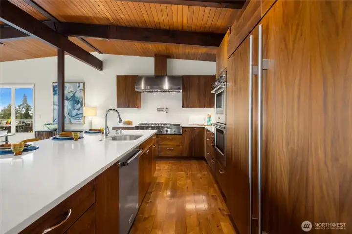 Full door side-by-side Sub Zero refrigerator and freezer. Cabinets include extensive accessories and storage devices to make everyday life easy.