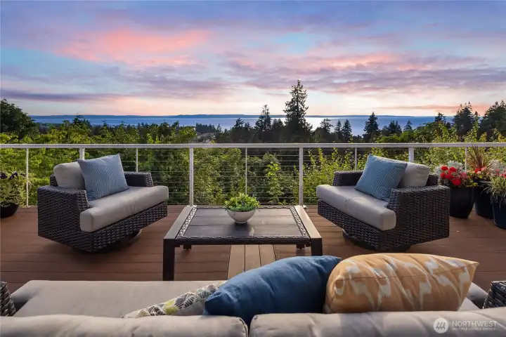 Deck surrounded by a cable railing system for unobstructed appreciation of the sweeping 180-degree views.