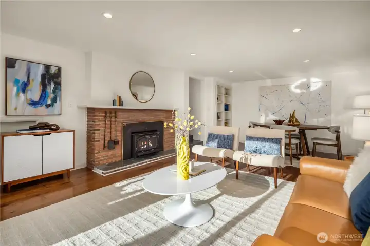 Lower family room or game room complete with a fireplace. Engineered hardwood floors extend the full length of the downstairs, including the two bedrooms—conveniently located full bathroom off the family room.