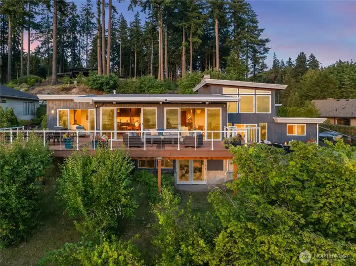 The main west-facing windows of the home have protective UV film to improve energy efficiency, reduce sun damage and fading of floors, furniture, art, etc.