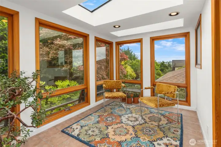 Sunroom with skylights opens to private back yard. Sunroom with skylights opens to private back yard.