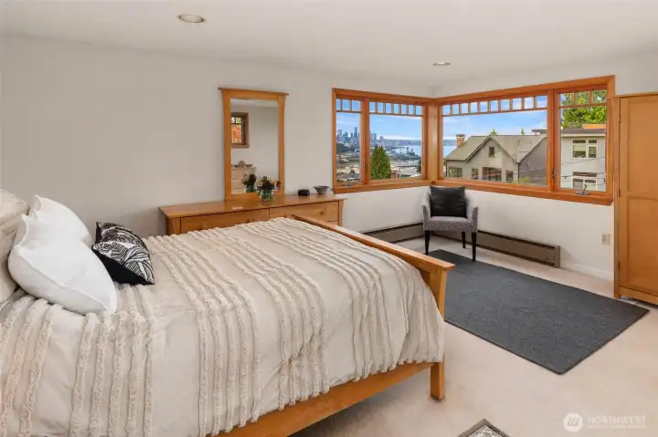 Large bedroom on second floor with beautiful city and water views. Large bedroom on second floor with beautiful city and water views.