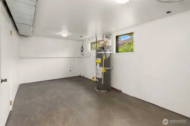Laundry/utility room in lower level. Laundry/utility room in lower level.