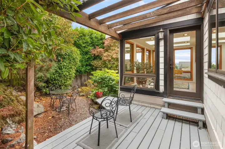 Private yard with deck off the sunroom. Private yard with deck off the sunroom.