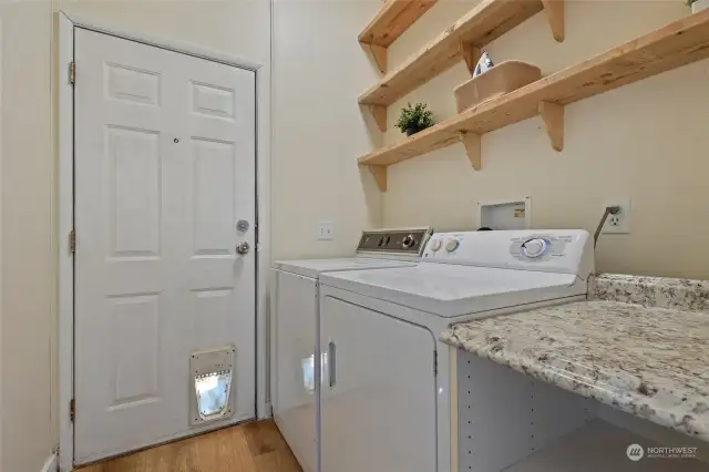 Utility room with door to backyard