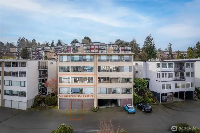 Two parking spaces - one in the garage and one directly in front of the garage. 2 guest spaces to left of garage.