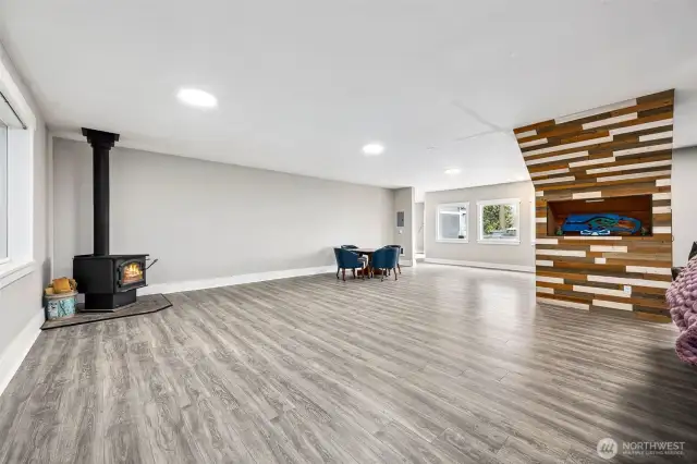 Huge movie room with wood burning fireplace.