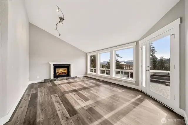 Living room with vaulted ceilings.