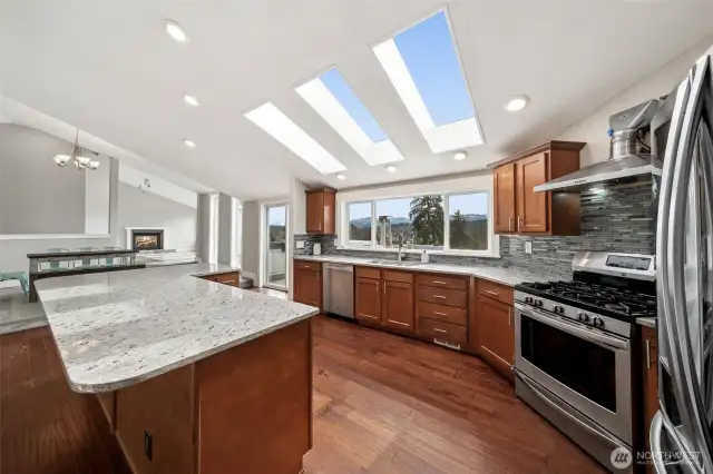 Gourmet kitchen with SS appliances.