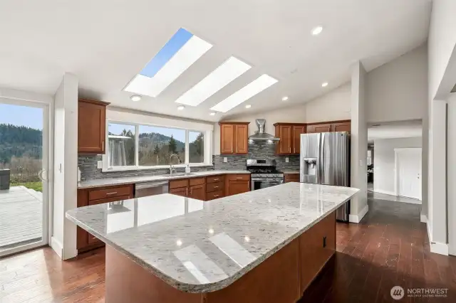 Light in bright kitchen with oversized island.