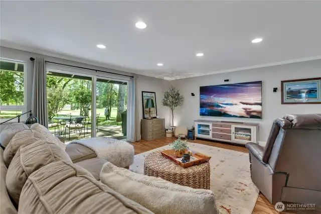 Family room with slider to deck, back yard and golf course.  Room for GameDay size TV!!!  LVP for ease in here as well!