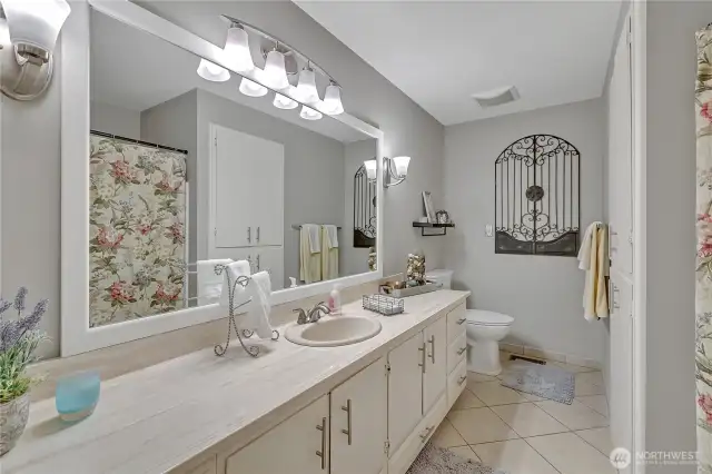 Hall bathroom for two side bedrooms & guests.  Tile flooring.