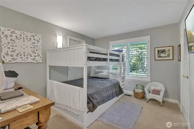 Side bedroom #2.  Closet to right.  Plantation shutters.