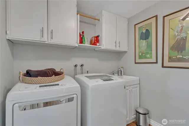 Laundry Room with washer/dryer that stay.  Note laundry sink!  There is a door to outside from here, making it an easy mudroom too! Door from here direct to dog run.  Makes poochie clean-up easy!