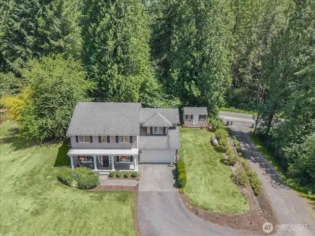 Overhead view of home and land. Driveway and road lead out Ames Lake-Carnation Road NE.  Private land offers expansive play spaces, garden area, shed and RV parking. Close to shopping, schools, parks and scenic trails.