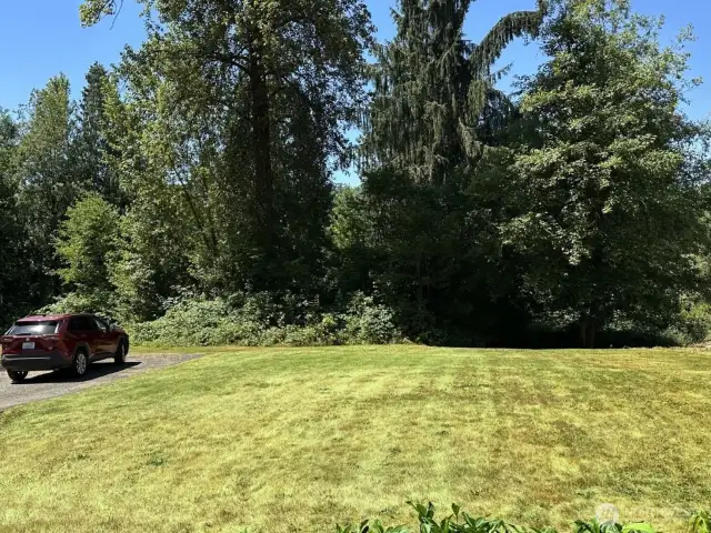 Large West facing play, garden area in front of home.