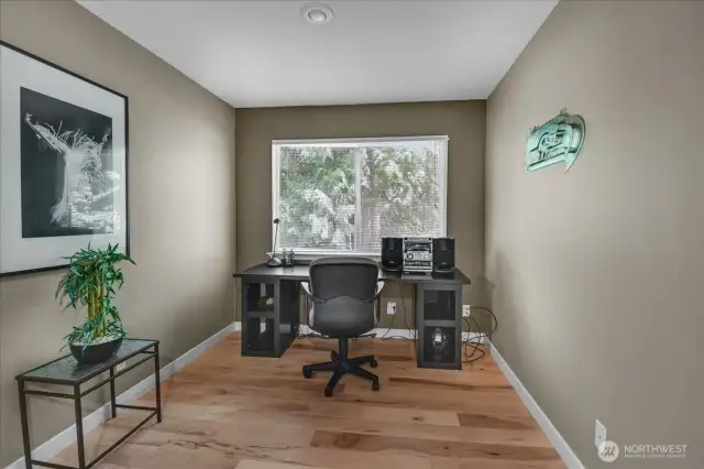 Bonus/Den or Home Office area overlooks quiet backyard.