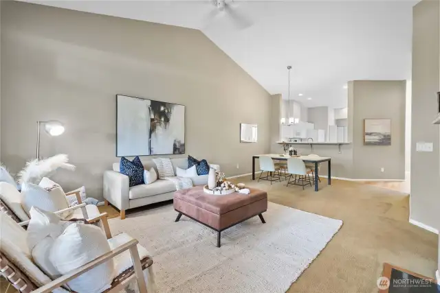 Bright open layout combining kitchen, dining, and living spaces.