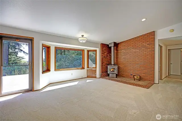 A door with screen leads out onto the large back deck.