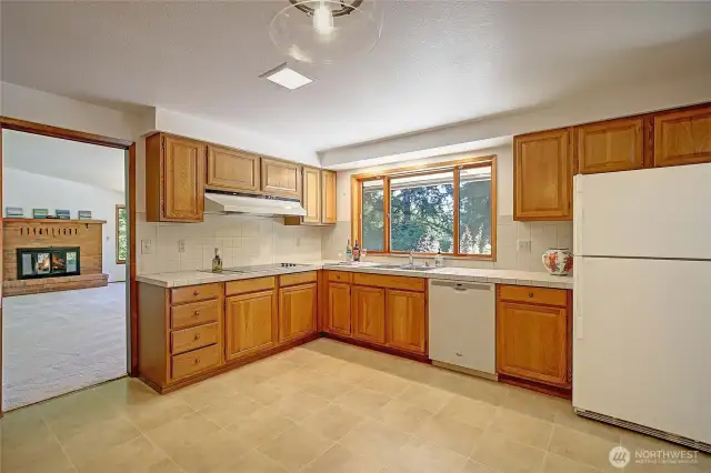 Central to the heart of the home is the abundant sized kitchen with dual accessibility doors
