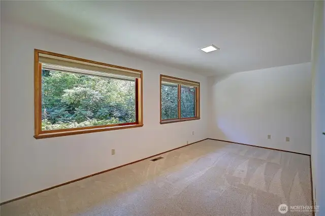 Expansive yet inviting, the layout of this versatile space offers both function and flexibility. A home office, creative studio, or media retreat the possibilities are endless, and the vibe is always elevated.  Framed by large picture windows that flood the room with natural light and offer serene views that change with the seasons.