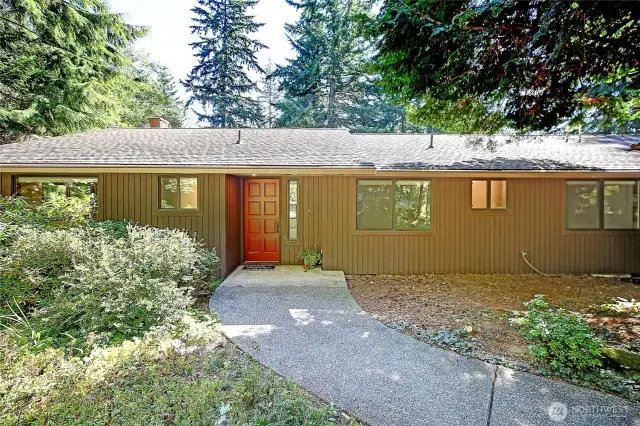 With its low profile and horizontal elegance, this Rambler-style home makes a quiet yet confident statement from the very first glance.