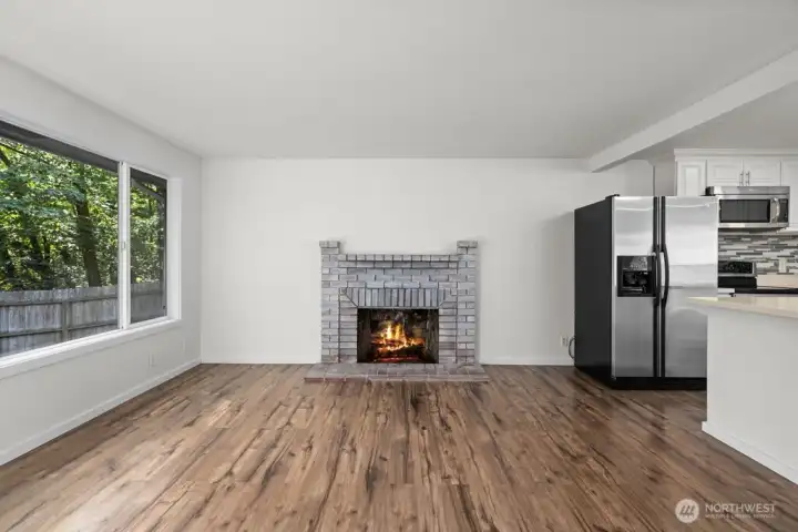 Large living room windows provide natural lighting