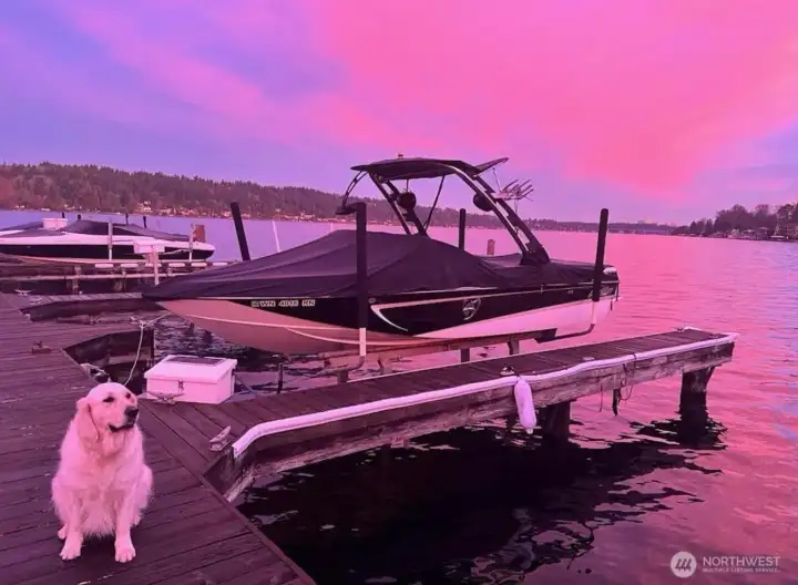 Sellers boat moored on a leased slip at sunset.