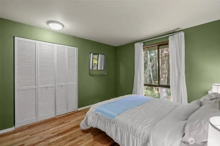 Bedroom 2 with hardwood floors.