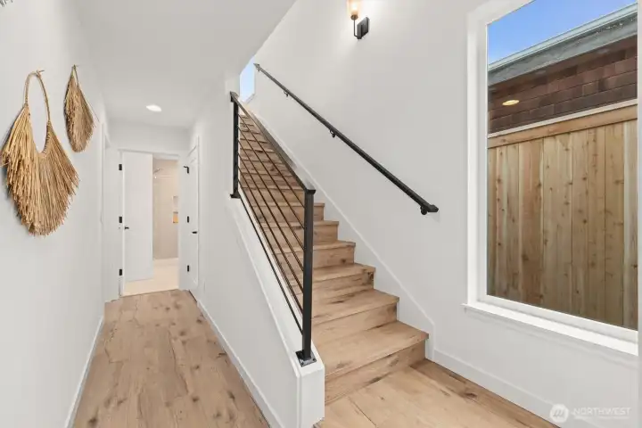 Stairway to 2nd floor and large living area.