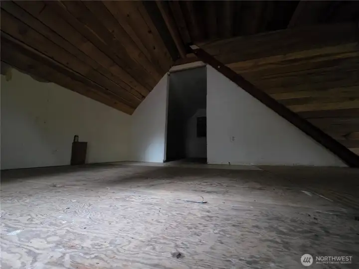 upstairs loft, with another small room across