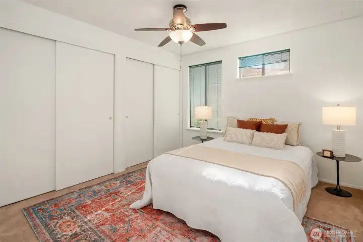 Main level guest room with oodles of closet space, plus an entrance to the bathroom.