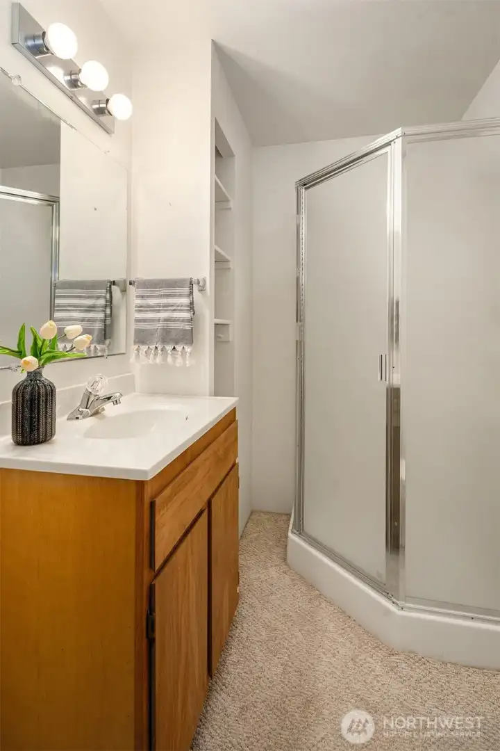 Lower level 3/4 bathroom with access from the garage.