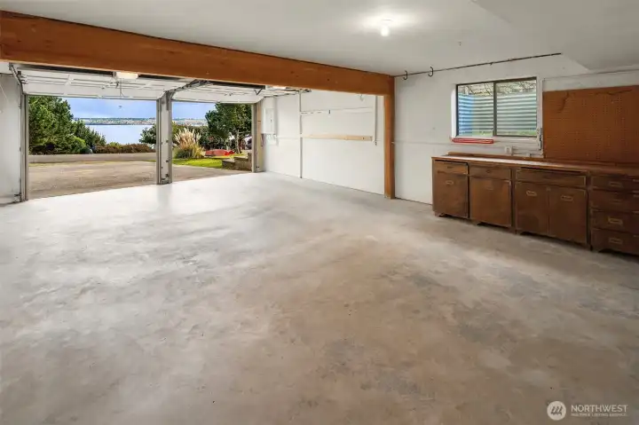The attached 2-car garage has a workbench, utility sink, large storage closet, as well as a 3/4 bathroom.
