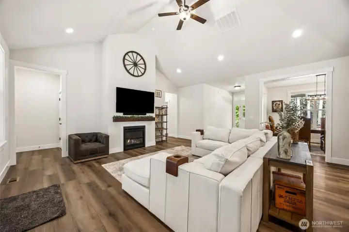 Family room, doorway to left of fireplace leads to primary bedroom.
