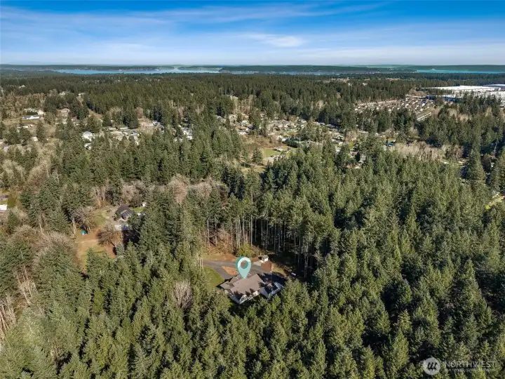 Secluded, private home surrounded by towering evergreens and just a few minutes to restaurants, shopping & recreation.