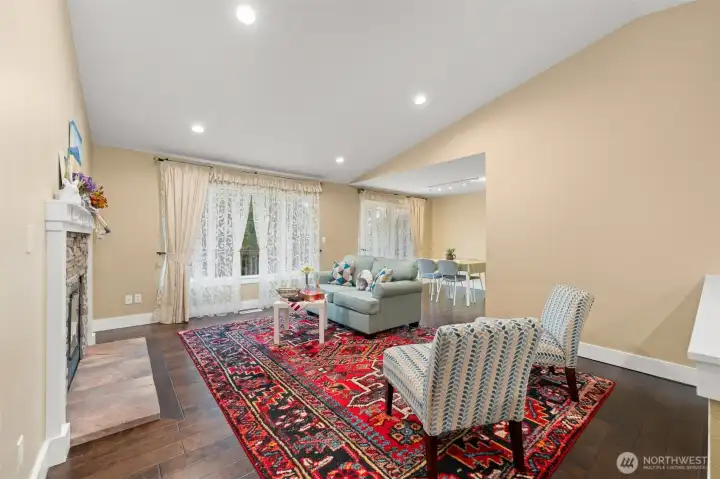 Vaulted ceilings, walls of windows, gleaming hardwood floors, abundance of spaces.