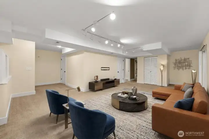 Lower-level extra large rec room is vitually staged
