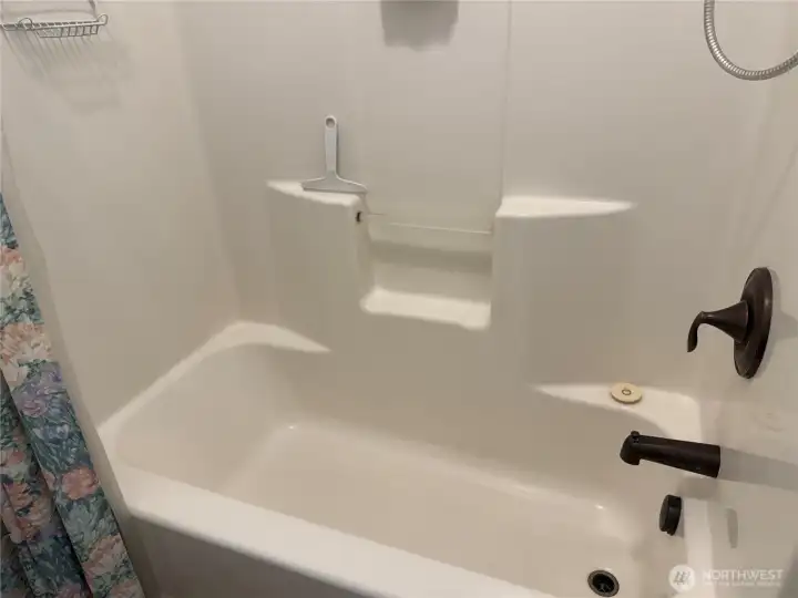 Bath and shower combo in the water closet section, upstairs bathroom.