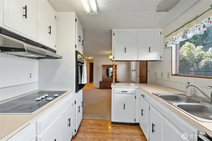 This functional kitchen opens up into the dining room.
