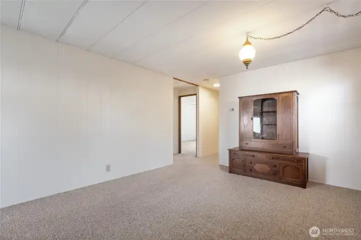 Bedrooms are located on the left and the hallway bathroom & utility room are on the right, down the hall.