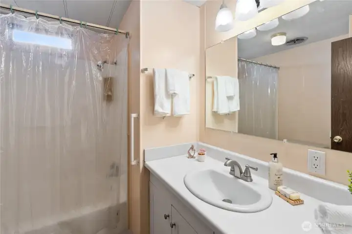 The main bathroom is bright & clean and has everything that you could need... even a grab bar.
